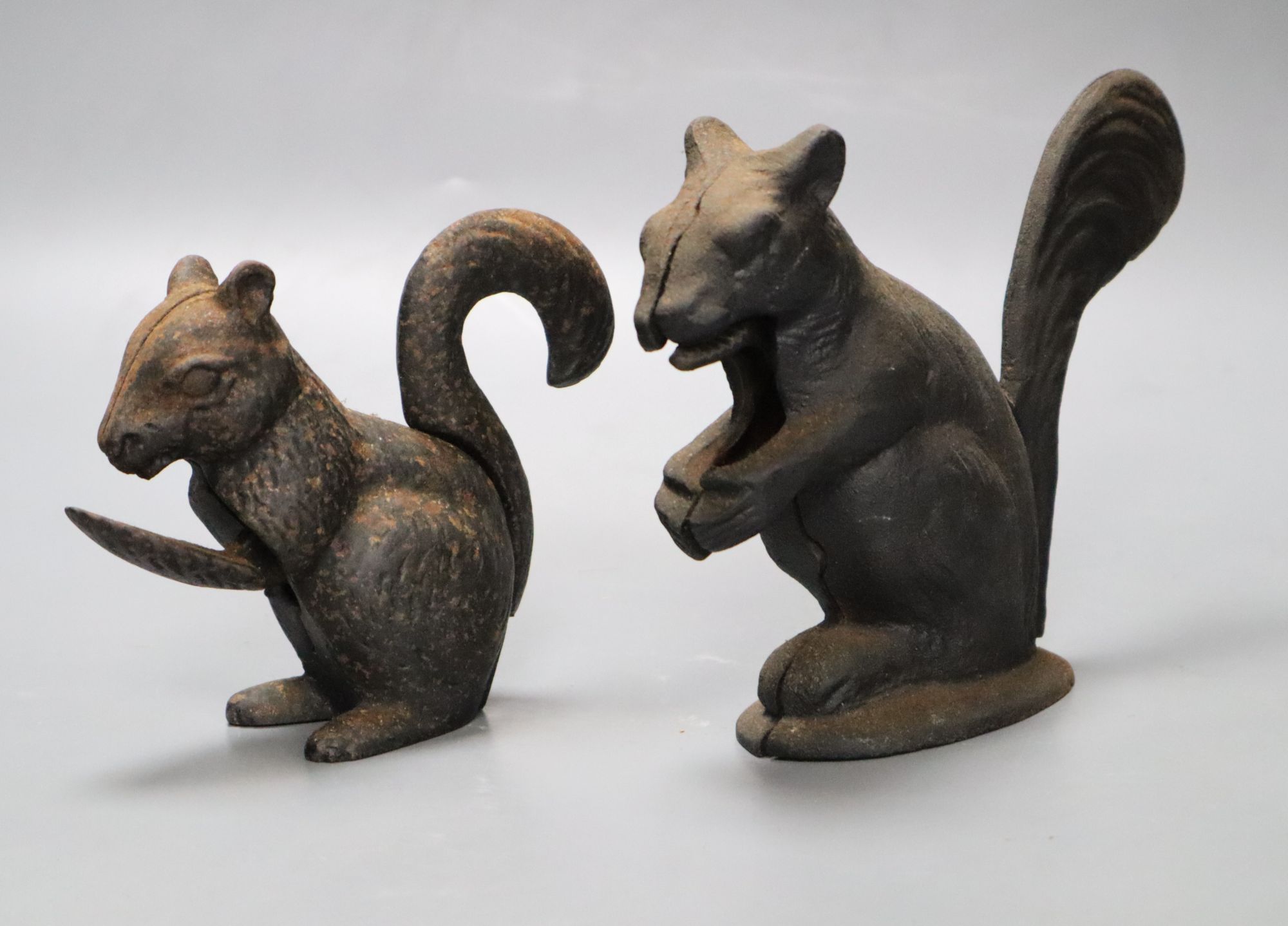 Two cast iron squirrel nutcrackers, tallest 13.5cm